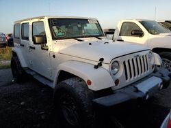 Salvage cars for sale from Copart Arcadia, FL: 2010 Jeep Wrangler Unlimited Sahara