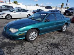Salvage cars for sale from Copart Punta Gorda, FL: 1998 Pontiac Grand AM SE