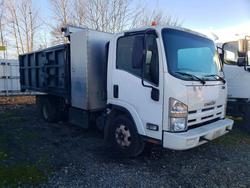 Salvage trucks for sale at Woodburn, OR auction: 2011 Isuzu NPR HD Dump Truck