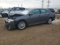 Salvage cars for sale from Copart Elgin, IL: 2014 Toyota Camry Hybrid