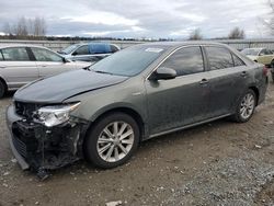 Salvage cars for sale from Copart Arlington, WA: 2012 Toyota Camry Hybrid