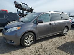 Toyota Sienna xle salvage cars for sale: 2014 Toyota Sienna XLE