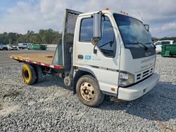 2006 Isuzu NPR Flatbed Truck en venta en Jacksonville, FL