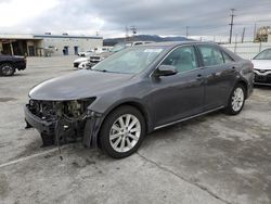 Salvage cars for sale from Copart Sun Valley, CA: 2013 Toyota Camry Hybrid