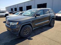 Salvage cars for sale from Copart Jacksonville, FL: 2011 Jeep Grand Cherokee Laredo