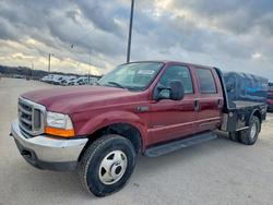 Salvage trucks for sale at Grand Prairie, TX auction: 2000 Ford F350 Flatbed Truck