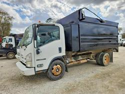 Salvage trucks for sale at Greenwell Springs, LA auction: 2012 Isuzu NPR HD Refuse Truck