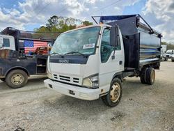 Salvage trucks for sale at Greenwell Springs, LA auction: 2007 Isuzu NPR Refuse Truck