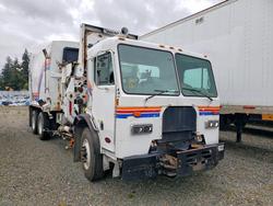 Salvage trucks for sale at Spanaway, WA auction: 2009 Peterbilt 320 Refuse Truck