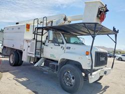 Salvage trucks for sale at Colton, CA auction: 1997 GMC C7 Forestry Bucket Truck