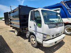 Salvage trucks for sale at Greenwell Springs, LA auction: 2006 Isuzu NPR Dump Truck