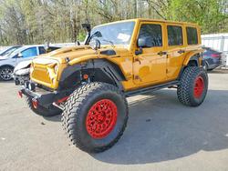 Jeep salvage cars for sale: 2014 Jeep Wrangler Unlimited Sport