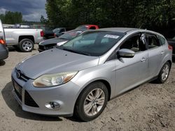Salvage cars for sale from Copart Arlington, WA: 2012 Ford Focus SEL
