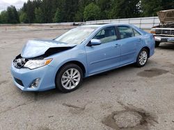 Salvage cars for sale from Copart Arlington, WA: 2013 Toyota Camry Hybrid