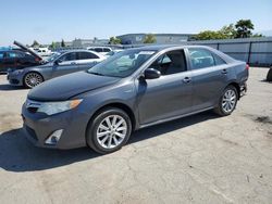 Salvage cars for sale from Copart Bakersfield, CA: 2012 Toyota Camry Hybrid