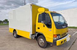 Salvage trucks for sale at Grand Prairie, TX auction: 2005 Isuzu NPR