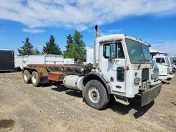 Salvage trucks for sale at Woodburn, OR auction: 2001 Peterbilt 320 ROLL-OFF Container Truck