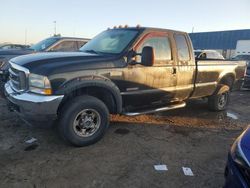 Salvage trucks for sale at Woodhaven, MI auction: 2004 Ford F350 SRW Super Duty