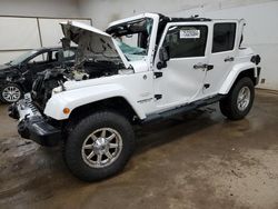 Jeep Wrangler salvage cars for sale: 2014 Jeep Wrangler Unlimited Sahara