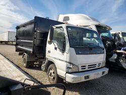 Salvage trucks for sale at Greenwell Springs, LA auction: 2007 Isuzu NPR Dump Truck