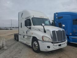 Salvage trucks for sale at Cedar Rapids, IA auction: 2014 Freightliner Cascadia 125