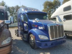 Salvage trucks for sale at Bridgeton, MO auction: 2015 Peterbilt Tractor 2015 Peterbilt 587 Semi Truck